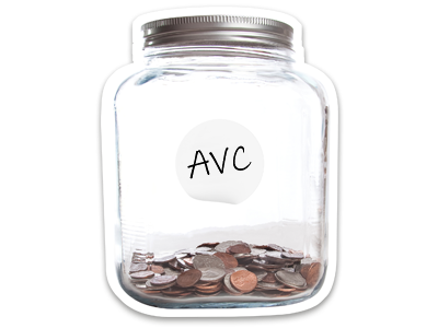 A glass jar, holding a small amount of coins. The jar is labelled AVC.