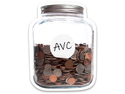 A glass jar, holding a large amount of coins. The jar is labelled AVC.